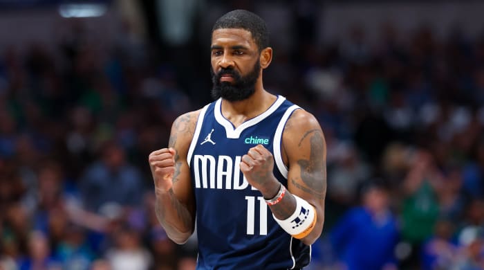 Dallas Mavericks guard Kyrie Irving clenches his fists.